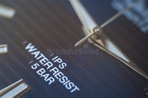 Close-up of watch dial and hands