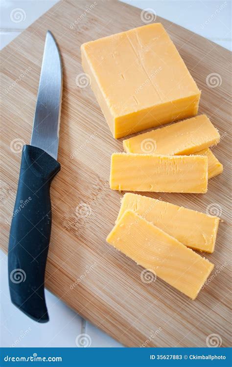 Cutting cheddar cheese