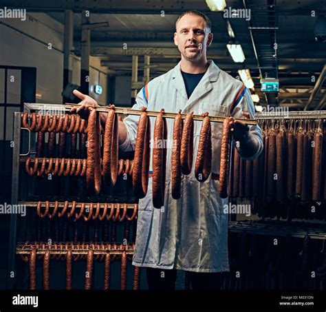 A container of sausages in the refrigerator